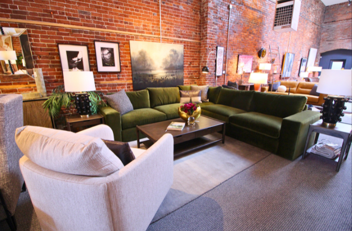 How to add in feature furniture or statement pieces like this large green sofa into your home